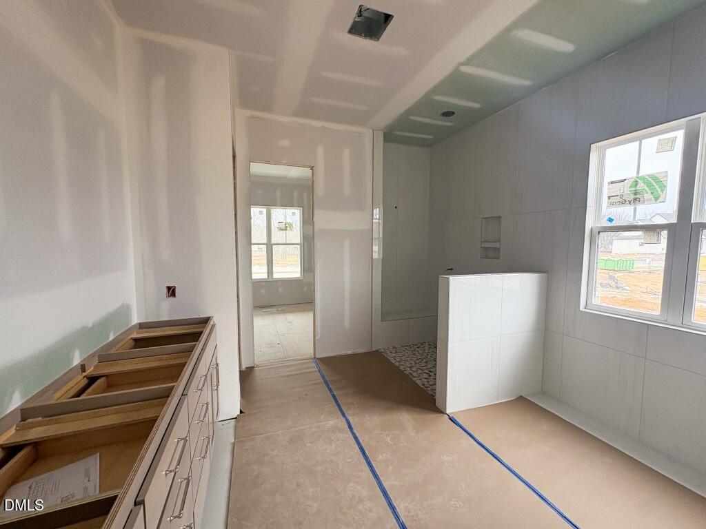5848 Carriage Drive Raleigh, NC 27603 - Photo 8 of 26 a view of an empty room with a window
