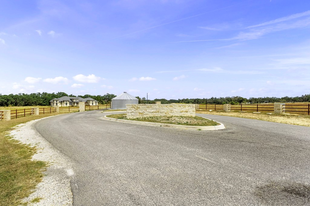 701 Windmill Ridge, Unit 90 Blanco, TX 78606 - Photo 18 of 18 a view of a lake with houses in the back