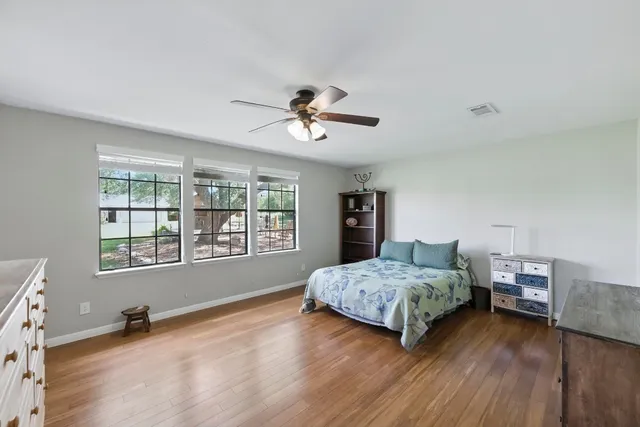 a living room with a bed furniture and a window