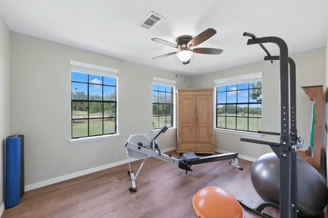 a living room with furniture pool table and a window