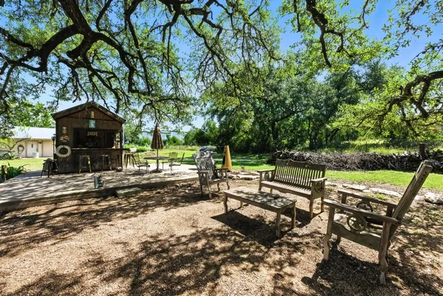 a view of a bench in a backyard