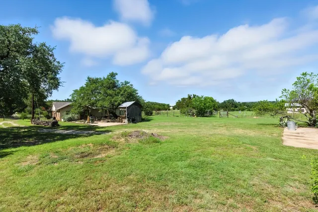 a backyard of a house with lots of green space