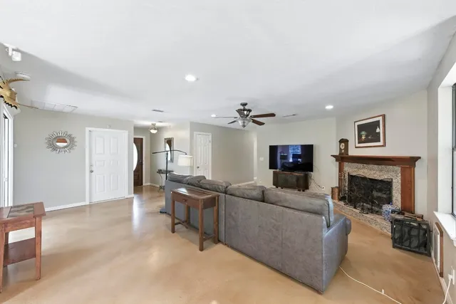 a living room with furniture and a fireplace