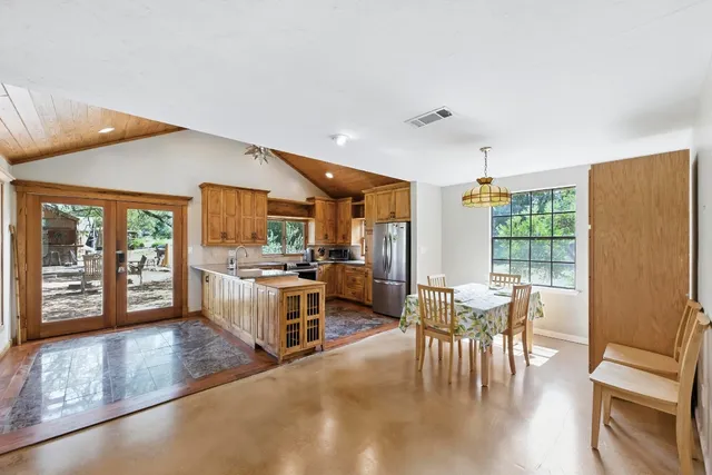 a view of a dining room with furniture window and outside view