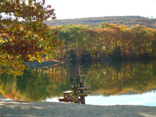 130 Buckland Road Ashfield, MA 01330 - Photo 3 of 11 a view of a lake with a mountain in the background