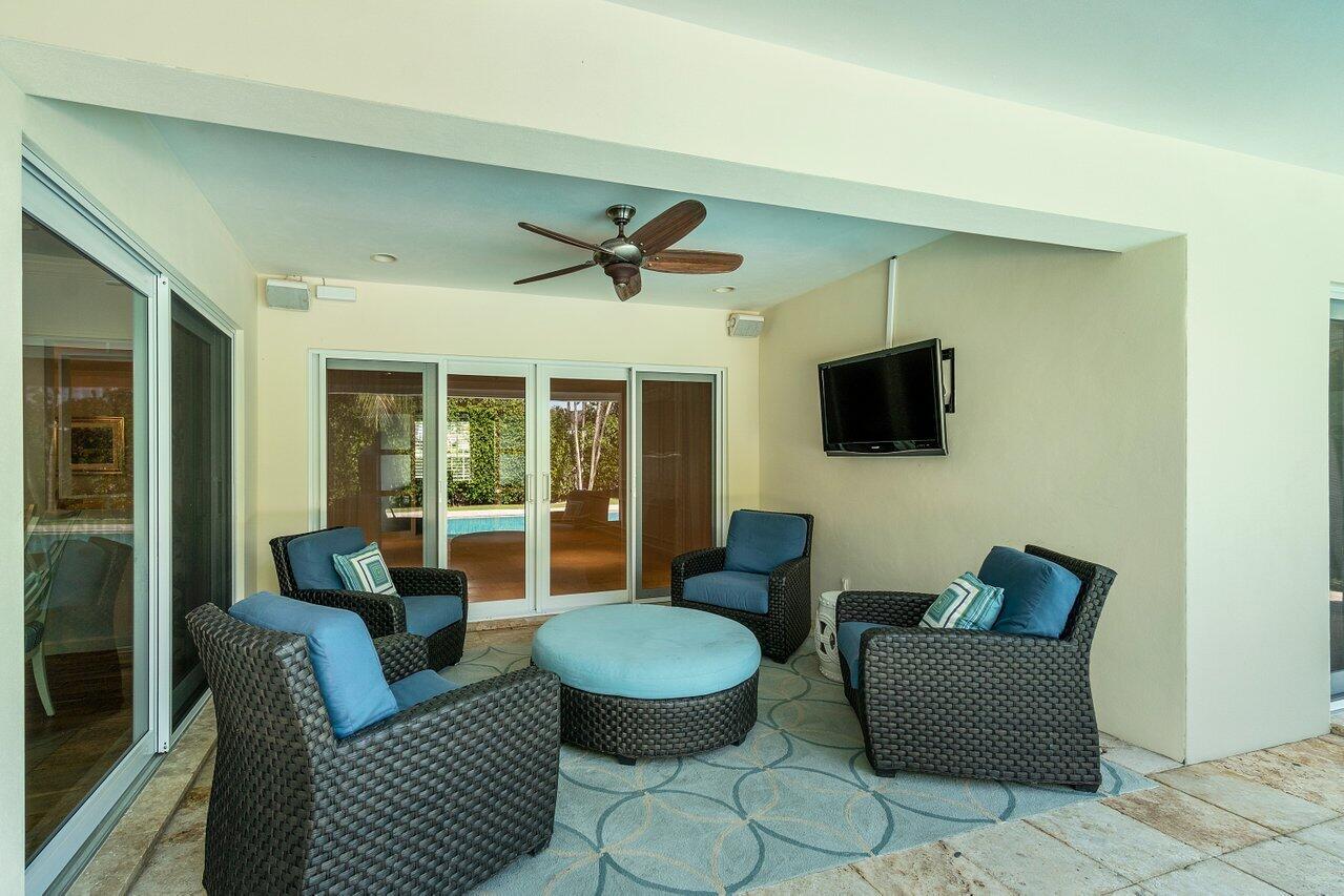 2377 East Silver Palm Road Boca Raton, FL 33432 - Photo 30 of 40 a living room with furniture a flat screen tv and a large window