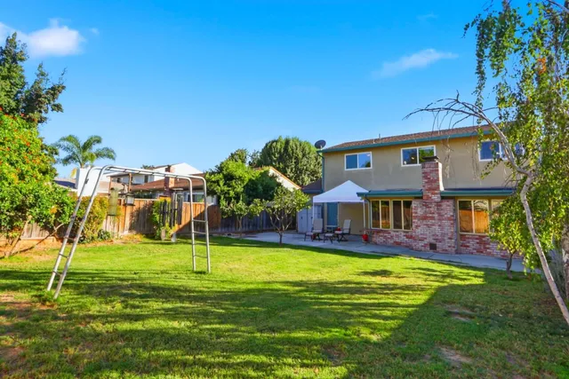 a view of a house with a big yard
