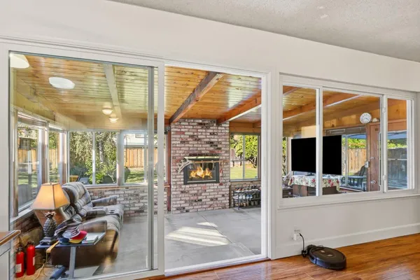a living room with furniture and large windows