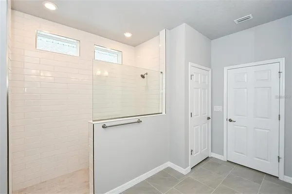 a view of a hallway with closet area