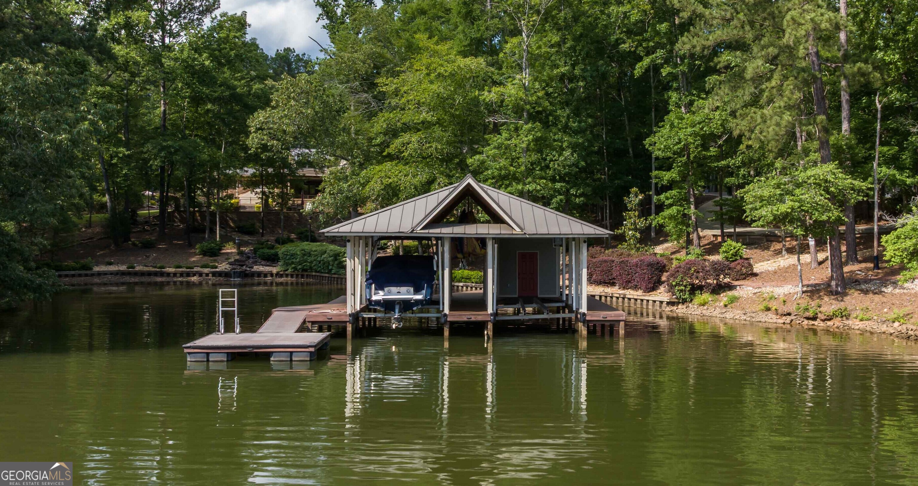 695 Boat Club Road Hamilton, GA 31811 - Photo 16 of 62 a view of a lake with roof deck