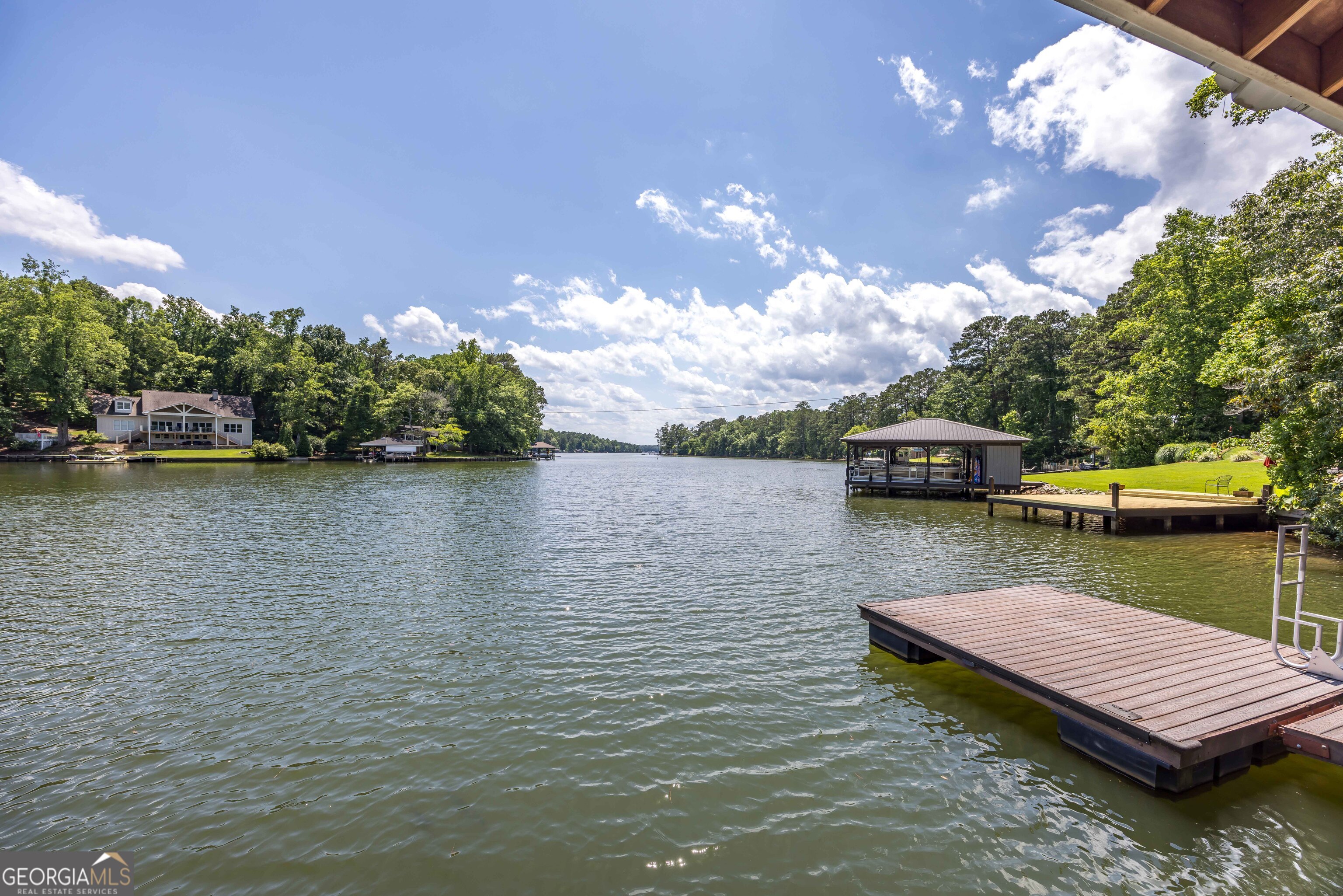 695 Boat Club Road Hamilton, GA 31811 - Photo 17 of 62 a view of a lake with chairs