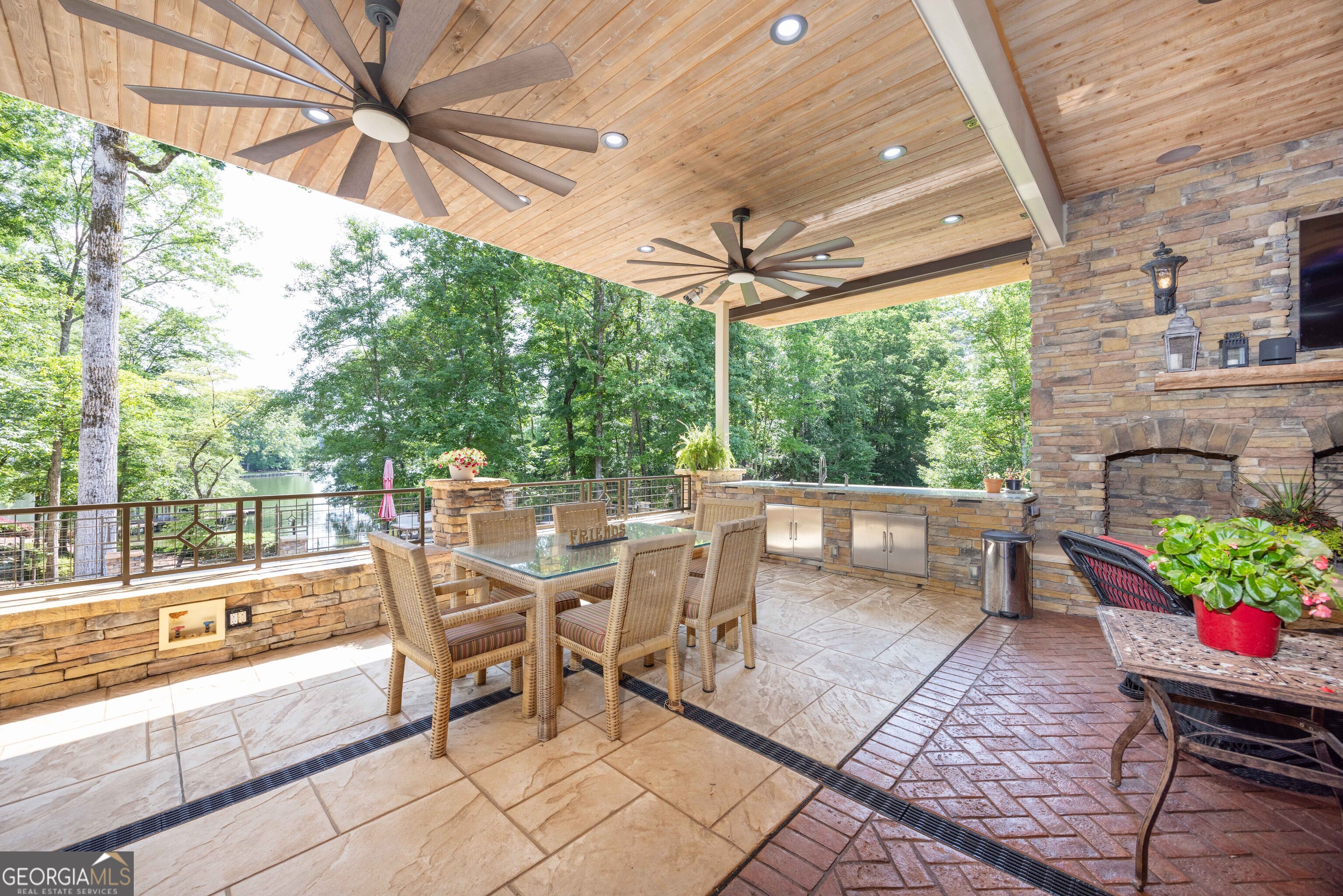 695 Boat Club Road Hamilton, GA 31811 - Photo 49 of 62 a view of a patio with a dining table and chairs