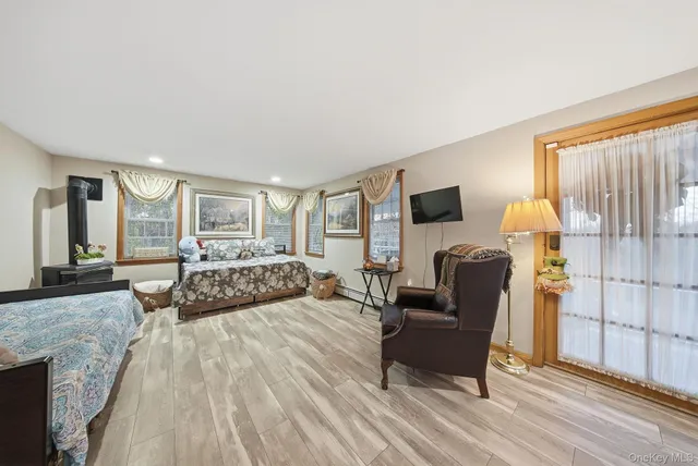 a bathroom with a sink a toilet and a shower