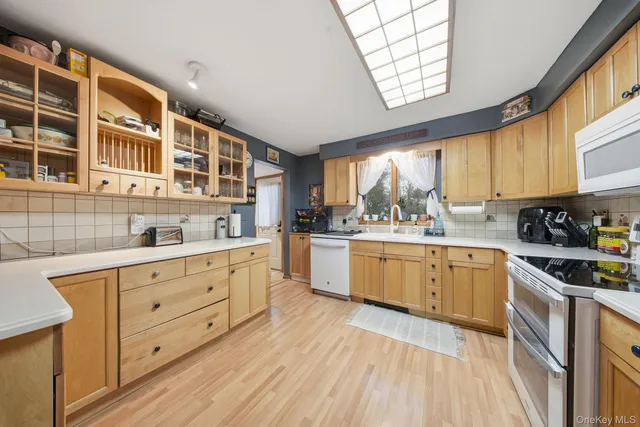 a kitchen with cabinets appliances and a counter top