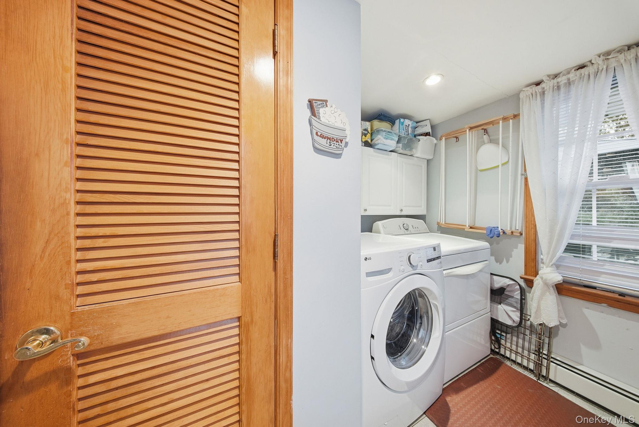 179 Reservoir Road Middletown, NY 10940 - Photo 26 of 50 Laundry area with separate washer and dryer, cabinet space, recessed lighting, and tile patterned flooring