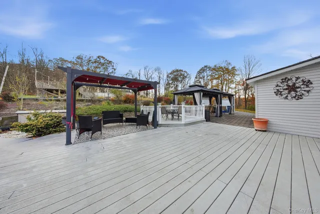 a view of a house with wooden deck