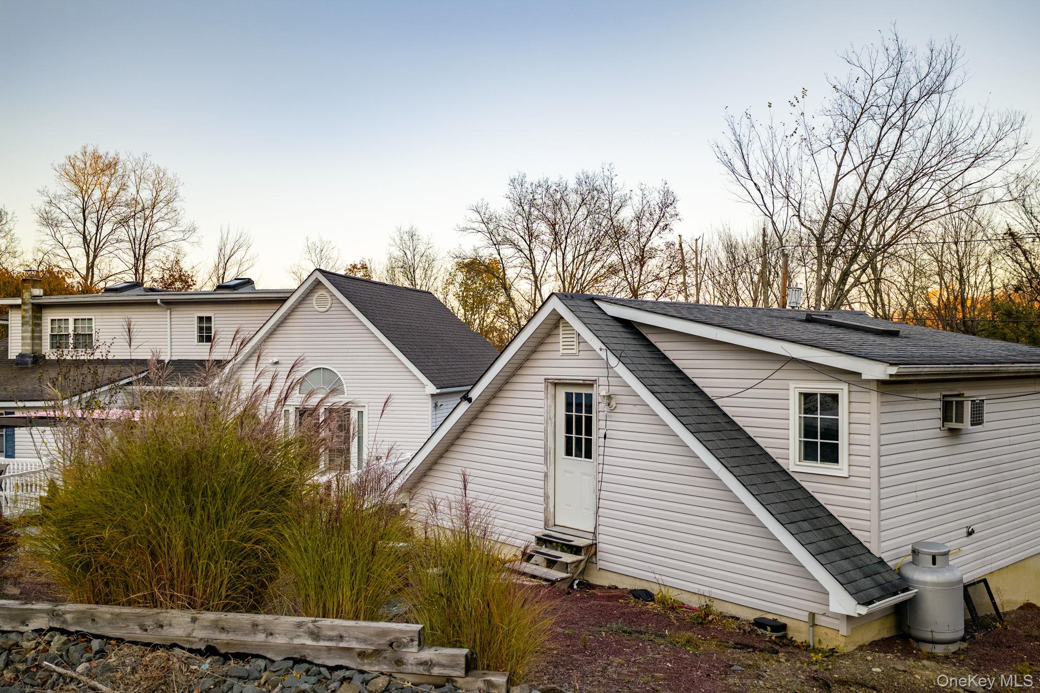179 Reservoir Road Middletown, NY 10940 - Photo 5 of 50 View of property exterior with a shingled roof and entry steps