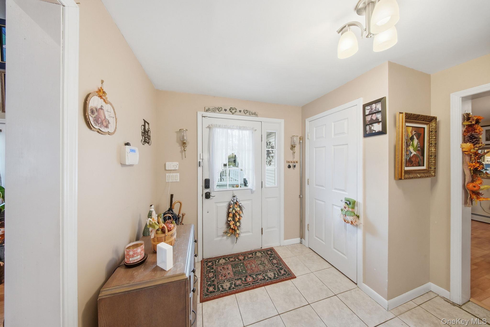 179 Reservoir Road Middletown, NY 10940 - Photo 9 of 50 Foyer entrance with light tile patterned flooring and baseboards