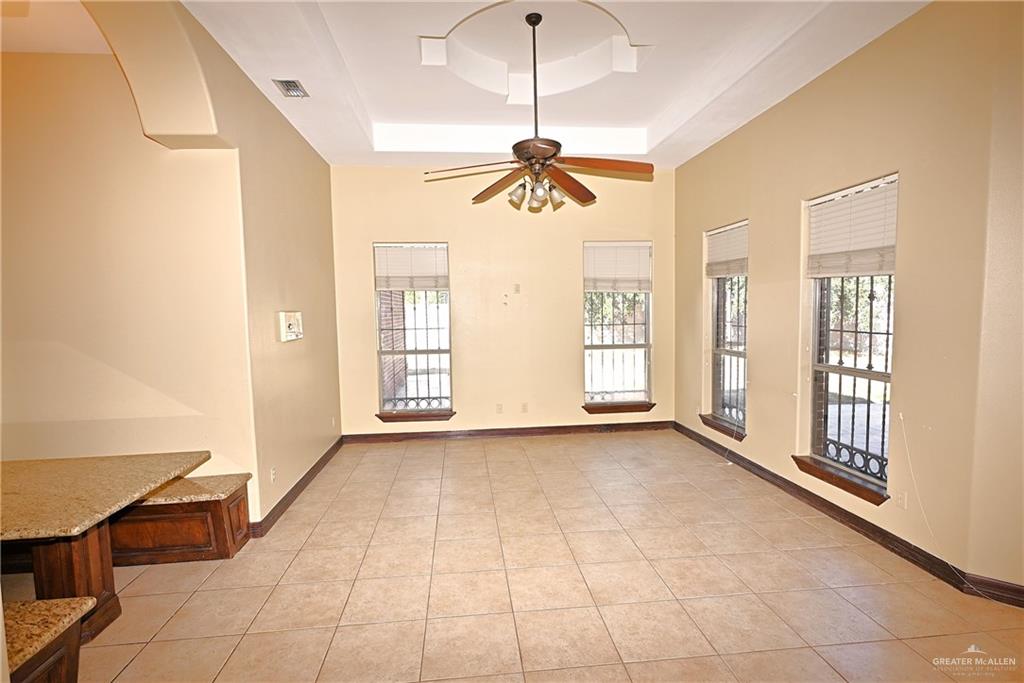7931 Dallas Circle Mission, TX 78574 - Photo 15 of 33 a view of an empty room with window and chandelier fan
