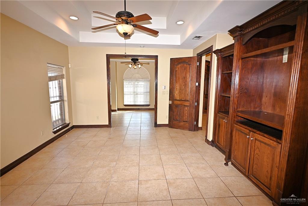 7931 Dallas Circle Mission, TX 78574 - Photo 27 of 33 a view of a hallway with wooden shelves
