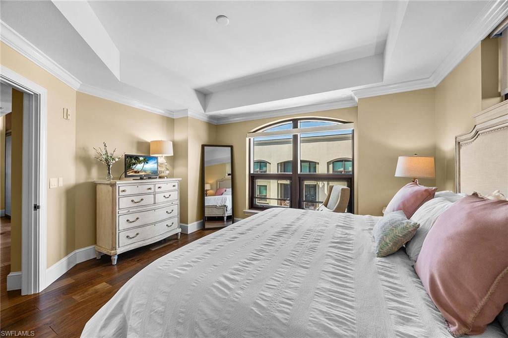 9123 Strada Place, Unit 7501 Naples, FL 34108 - Photo 12 of 28 a bedroom with a bed and a window
