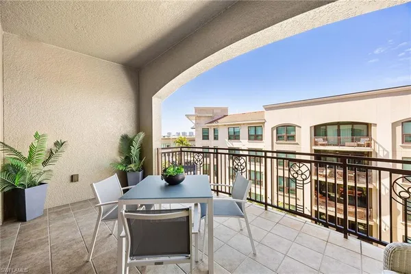 a view of balcony with furniture