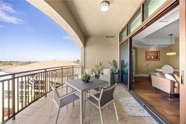 a view of a balcony with furniture