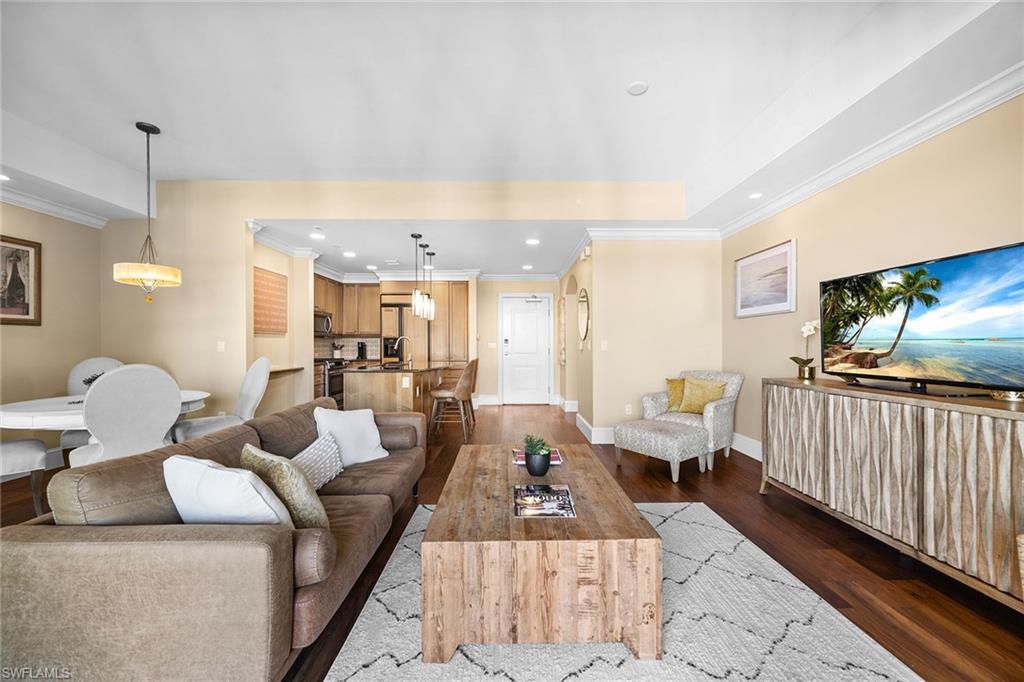 9123 Strada Place, Unit 7501 Naples, FL 34108 - Photo 7 of 28 a living room with furniture and a flat screen tv