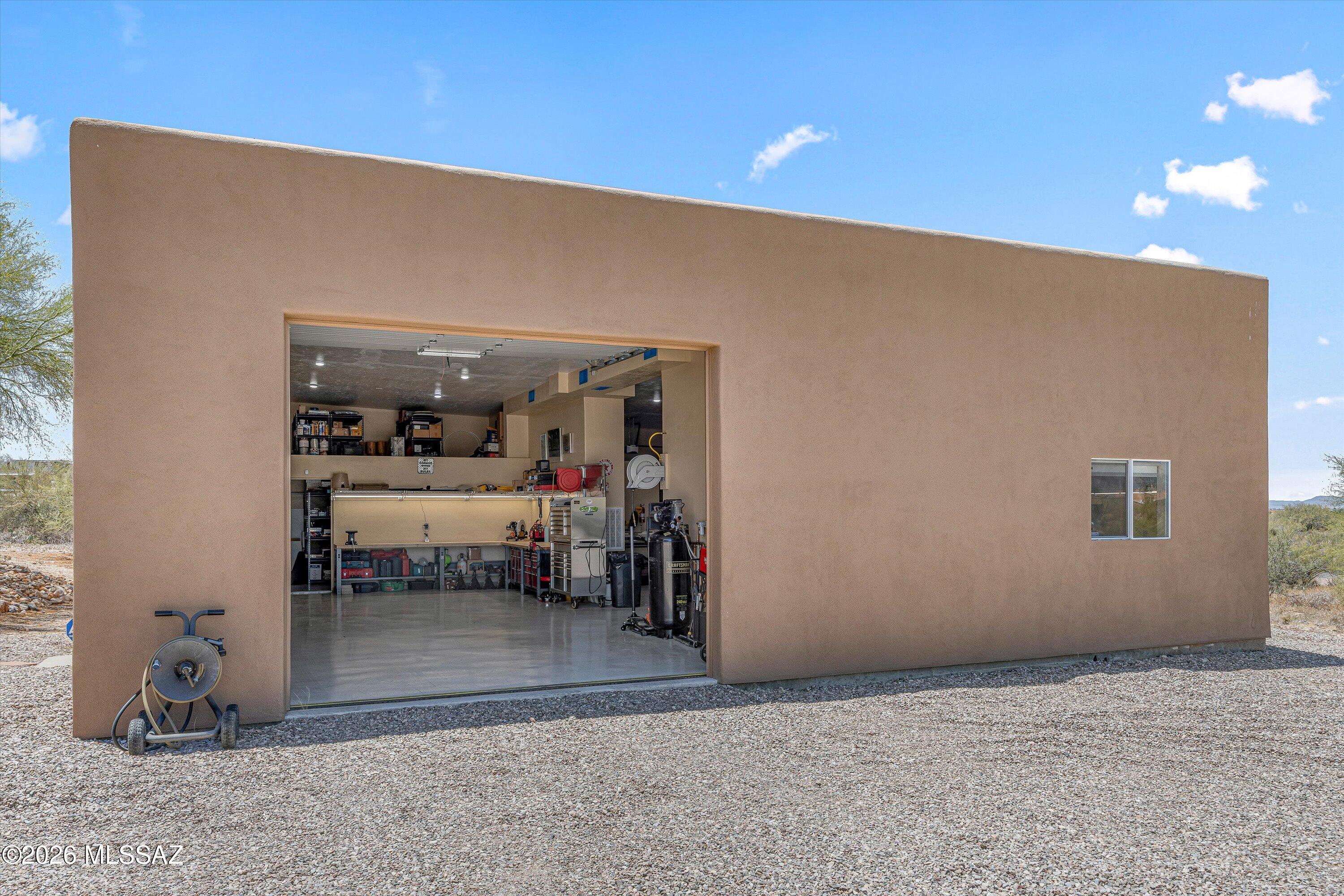 11160 East Golf Links Road Tucson, AZ 85730 - Photo 38 of 51 One of two garage doors on the workshop.