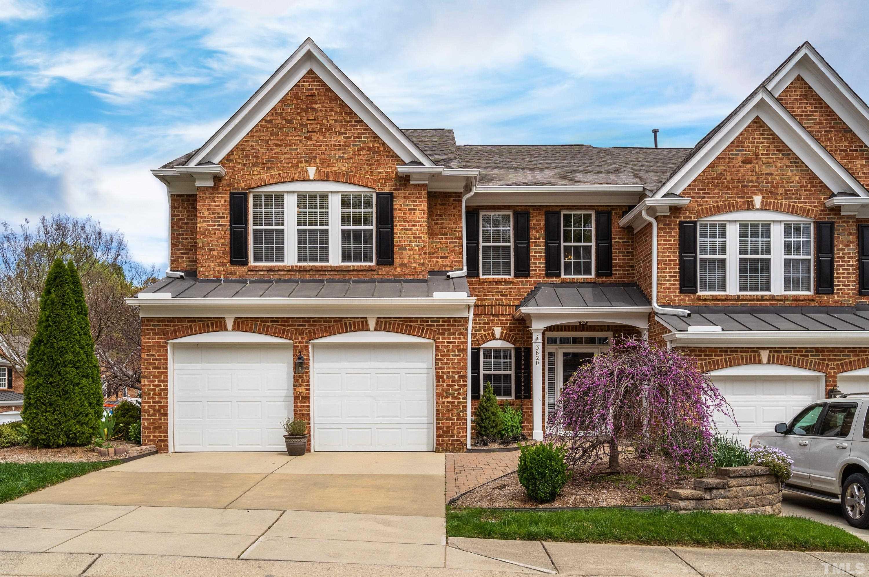 3620 Lion Ridge Court Raleigh, NC 27612 - Photo 1 of 23 a front view of a house with a yard and garage