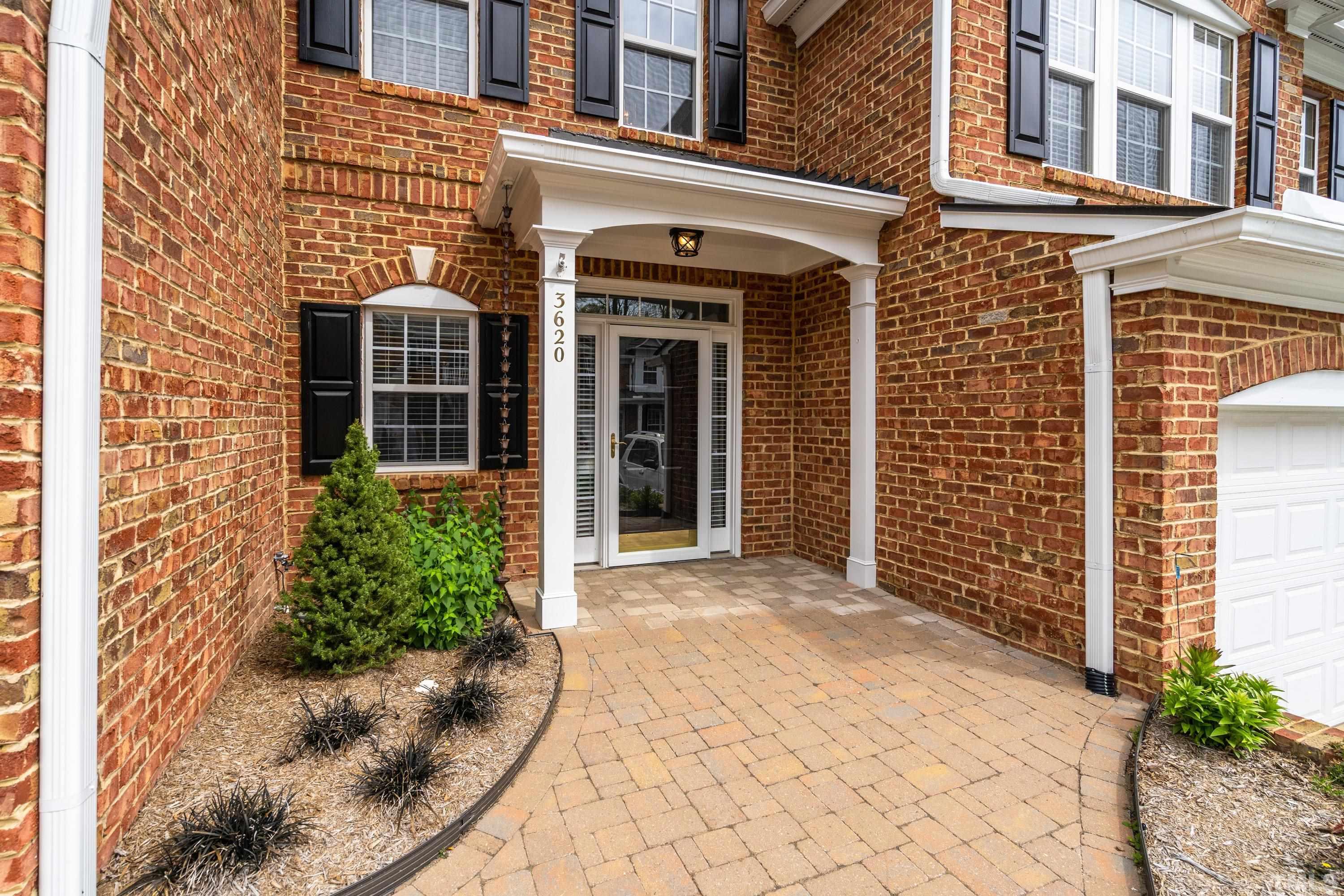 3620 Lion Ridge Court Raleigh, NC 27612 - Photo 2 of 23 front view of a brick building