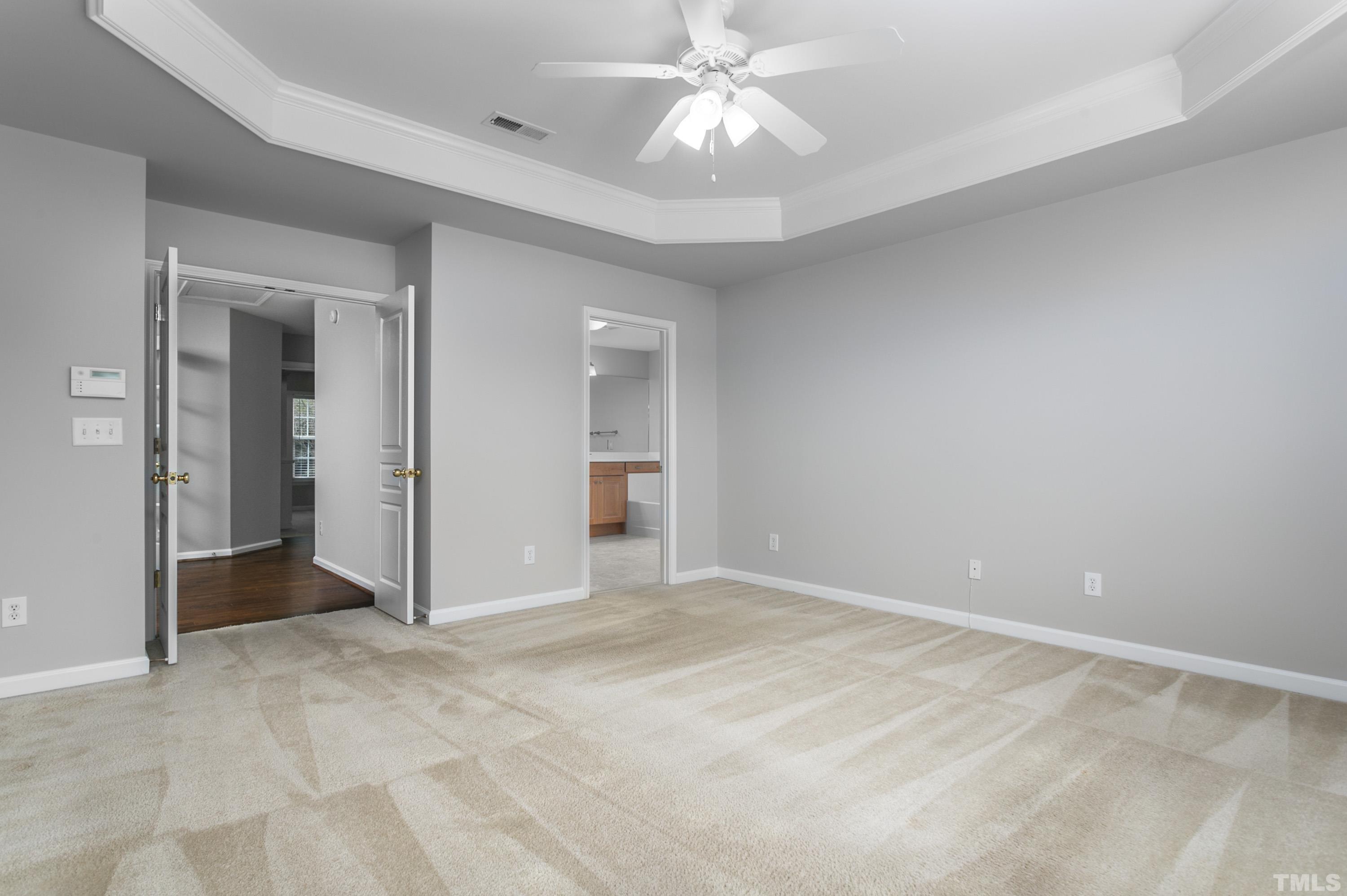 3620 Lion Ridge Court Raleigh, NC 27612 - Photo 19 of 23 an empty room with closet and a ceiling fan