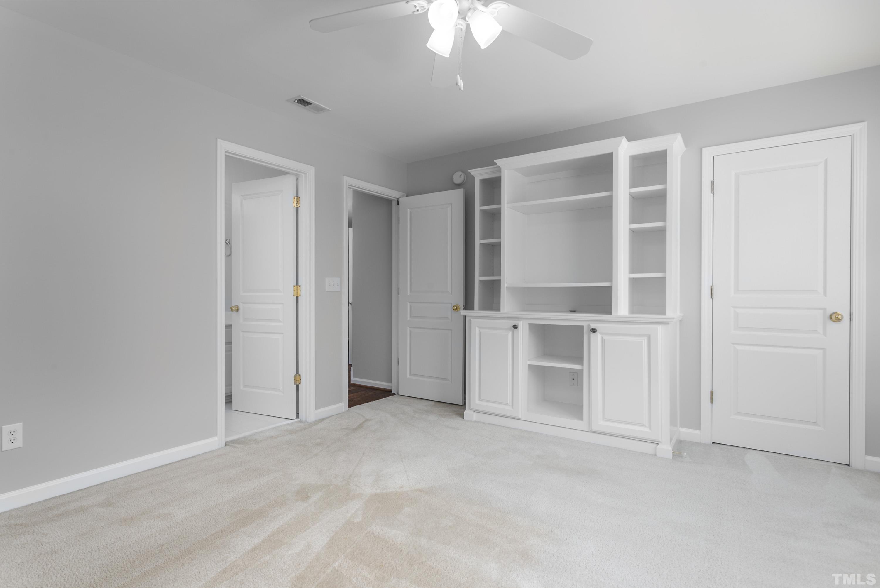 3620 Lion Ridge Court Raleigh, NC 27612 - Photo 22 of 23 an empty room with a empty shelves