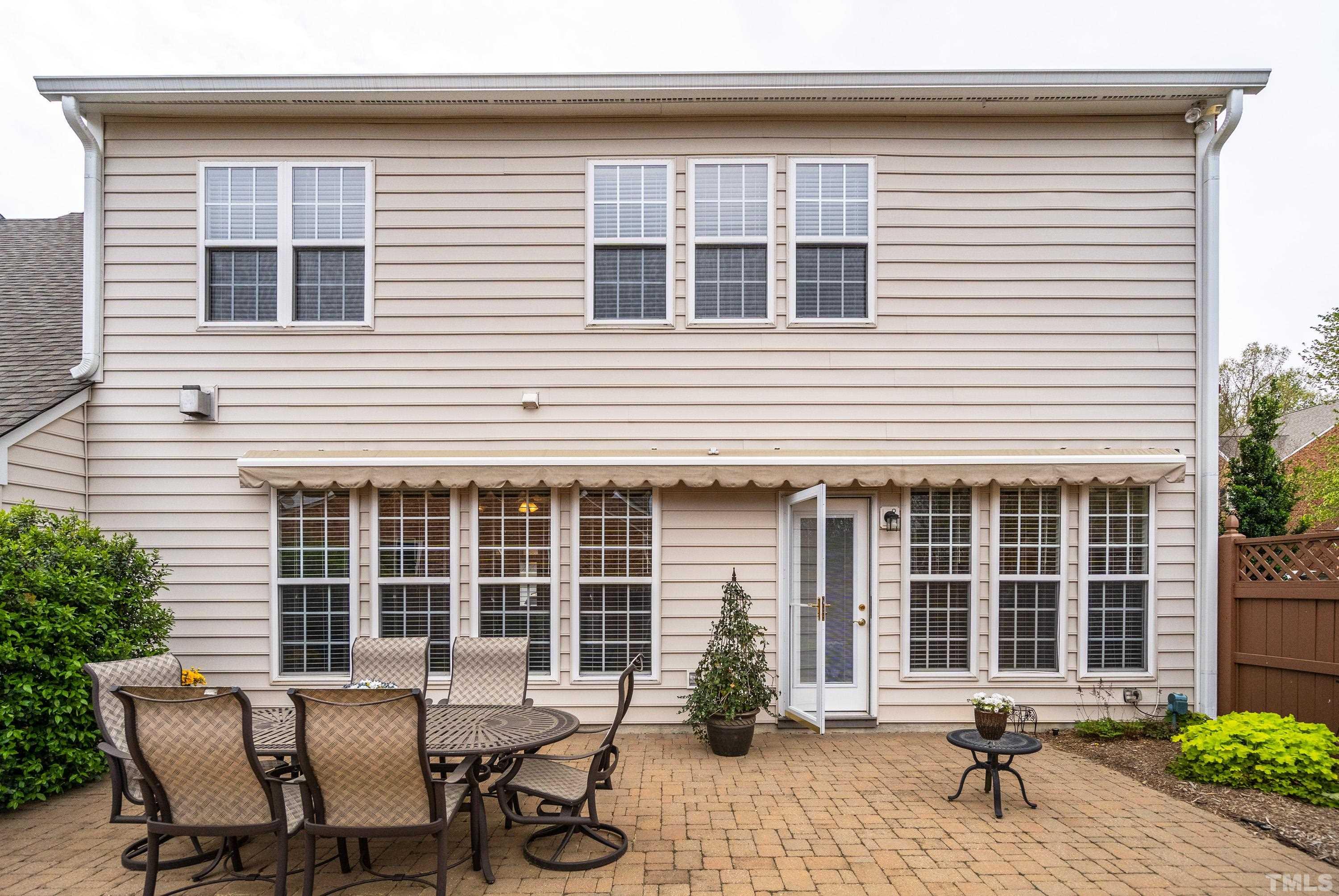 3620 Lion Ridge Court Raleigh, NC 27612 - Photo 5 of 23 a view of a house with chairs and table in a patio
