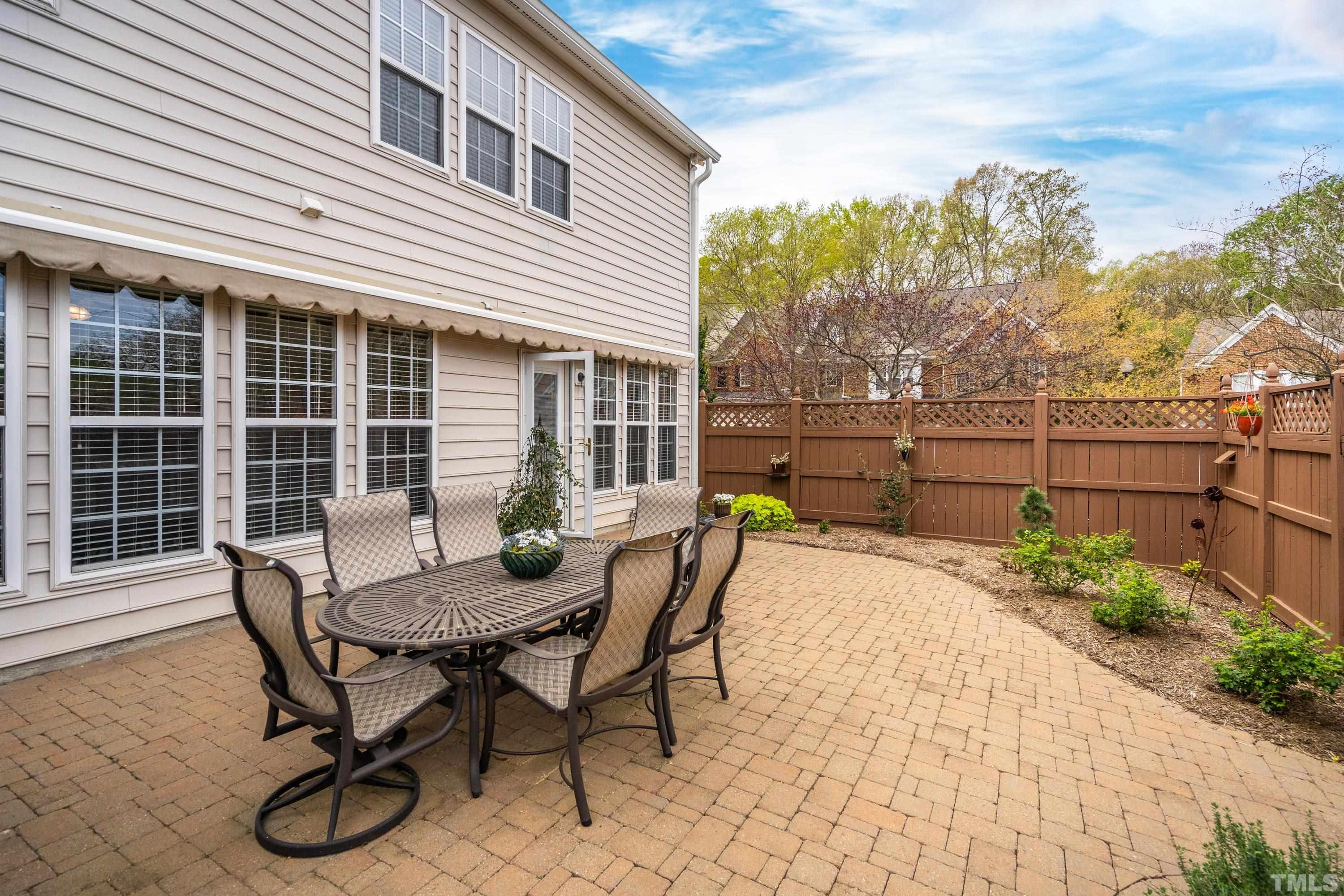 3620 Lion Ridge Court Raleigh, NC 27612 - Photo 8 of 23 a view of a patio with couple of chairs and potted plants