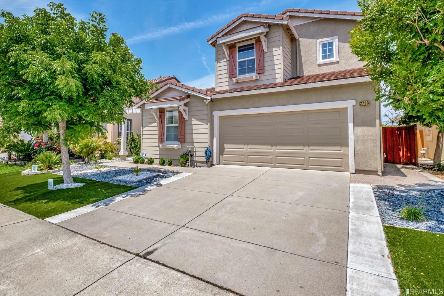 2783 Shellgate Circle Hayward, CA 94545 - Photo 2 of 2 a front view of a house with a yard and garage