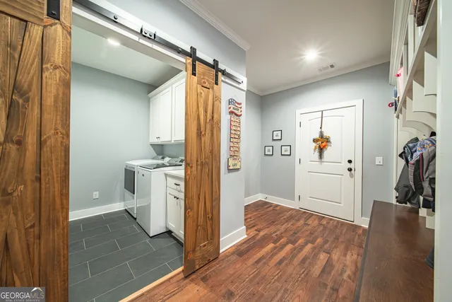 a bathroom with a sink mirror and toilet