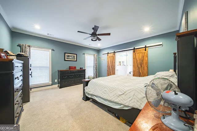 a en suite bathroom with a double vanity sink and a mirror