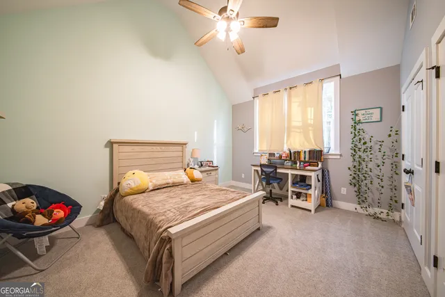 a bathroom with a double vanity sink mirror and shower