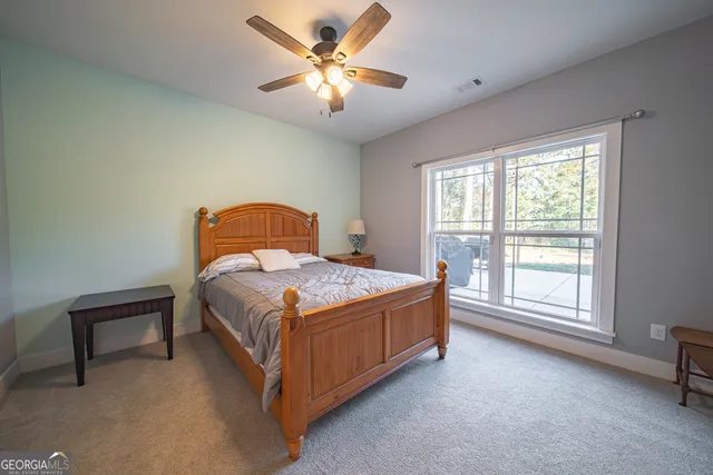 a view of swimming pool with outdoor seating and plants