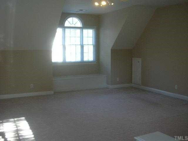 9420 Stone Mountain Road Raleigh, NC 27613 - Photo 10 of 12 Bonus room over garage with built in window seat & back stairs to kitchen Bonus Room