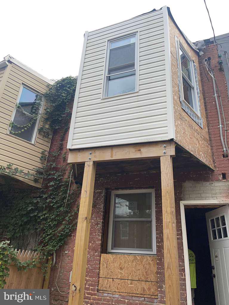 1726 Normal Avenue Baltimore, MD 21213 - Photo 15 of 18 a front view of a house