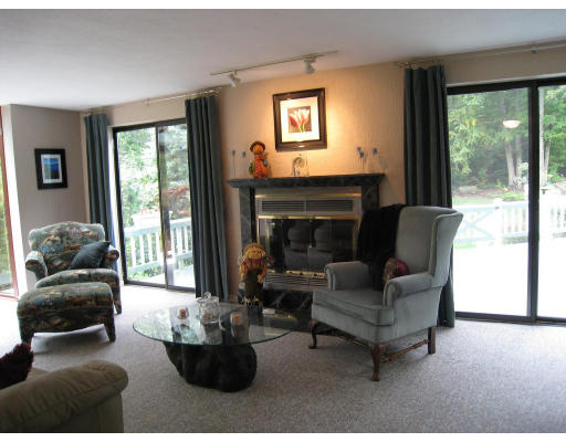 179 Harper Ridge Road Hampstead, NH 03826 - Photo 11 of 26 a living room with furniture and a fireplace