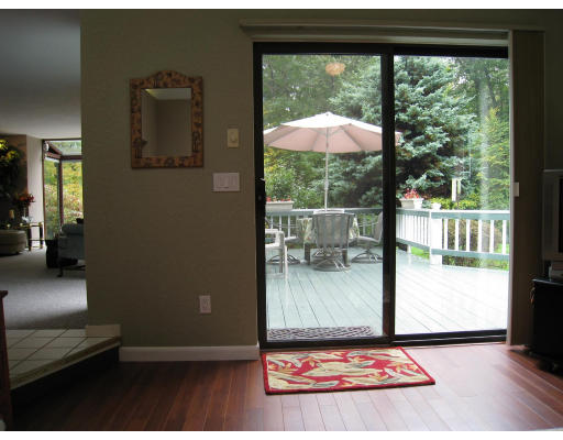 179 Harper Ridge Road Hampstead, NH 03826 - Photo 13 of 26 a living room with furniture and a floor to ceiling window