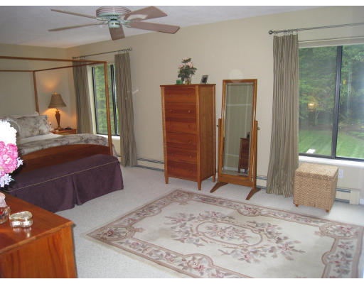179 Harper Ridge Road Hampstead, NH 03826 - Photo 16 of 26 a bedroom with a bed and a dresser