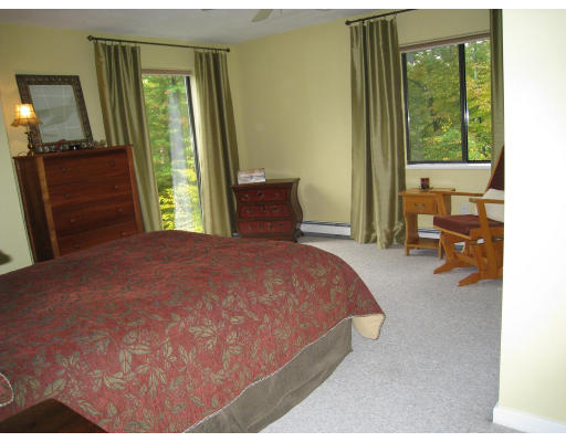 179 Harper Ridge Road Hampstead, NH 03826 - Photo 19 of 26 a bedroom with a bed and a large window