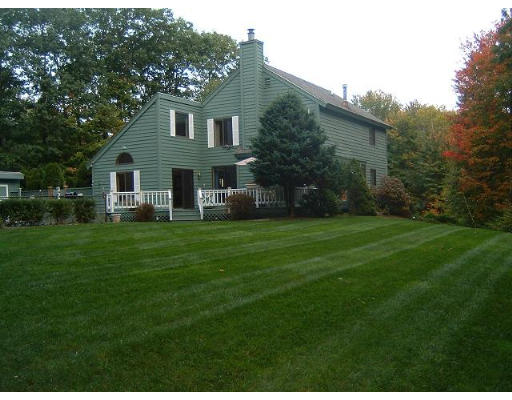 179 Harper Ridge Road Hampstead, NH 03826 - Photo 2 of 26 a front view of house with yard and green space