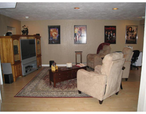 179 Harper Ridge Road Hampstead, NH 03826 - Photo 21 of 26 a living room with furniture and a flat screen tv