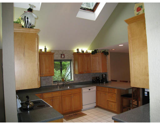 179 Harper Ridge Road Hampstead, NH 03826 - Photo 8 of 26 a kitchen with a sink and cabinets