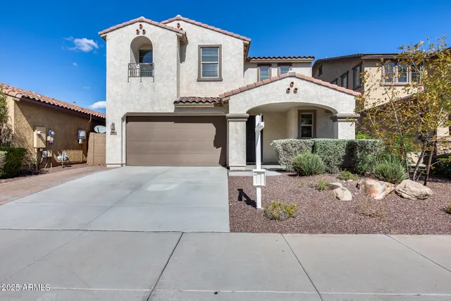 a front view of a house with yard